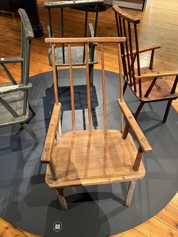An armchair with strongly raked legs.