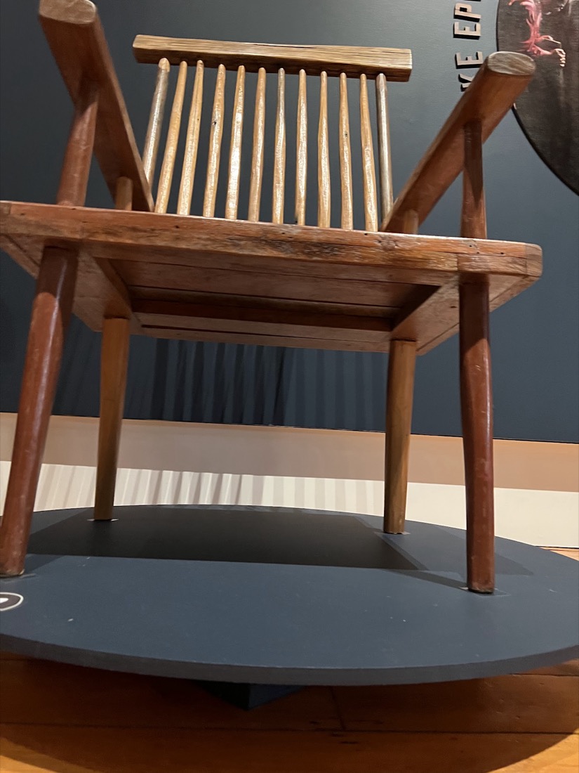 A two-seat Jimmy Possum settle in pale timber.
